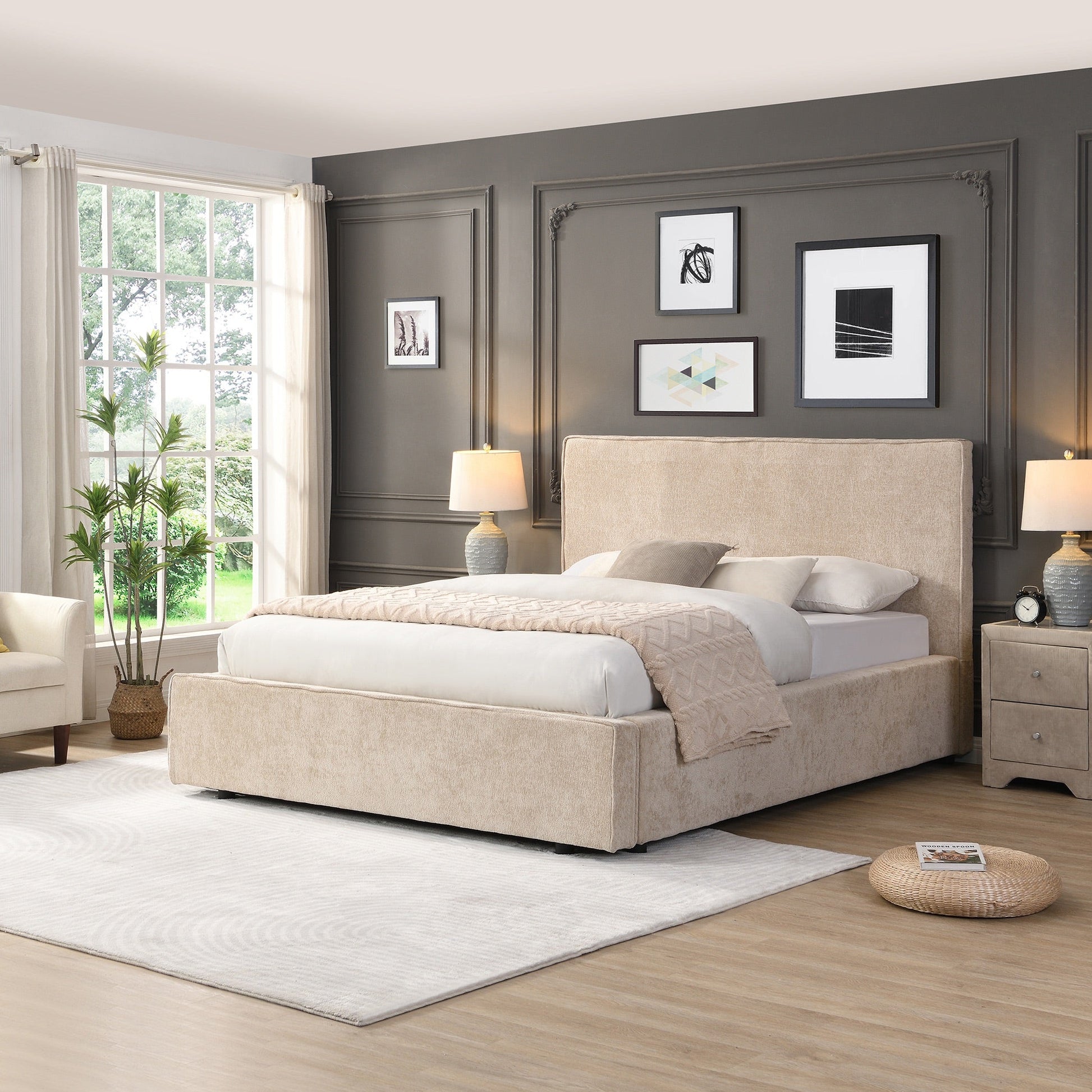 Modern bedroom with a beige upholstered bed, side tables, and wall art.